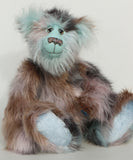 Clarence Cuddlemore artist teddy bear with light blue mohair and multi-coloured brown faux fur, sitting.