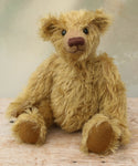 Clever Trevor sitting. Clever Trevor is a very sweet traditional one of a kind teddy bear made from wonderfully soft and fluffy mohair by Barbara Ann Bears, he stands 11 inches/ 28 cm tall. Clever Trevor is made from a gorgeous, quite long and feathery mohair, which is a warm gold with a hint of green in colour. Trevor has coffee coloured, German wool felt paw pads and black boot buttons for eyes, like the antique teddy bears