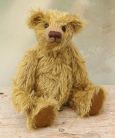 Clever Trevor sitting. Clever Trevor is a very sweet traditional one of a kind teddy bear made from wonderfully soft and fluffy mohair by Barbara Ann Bears, he stands 11 inches/ 28 cm tall. Clever Trevor is made from a gorgeous, quite long and feathery mohair, which is a warm gold with a hint of green in colour. Trevor has coffee coloured, German wool felt paw pads and black boot buttons for eyes, like the antique teddy bears