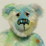 Close-up of Colin Cockles a colourful hand dyed mohair teddy bear 