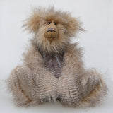 Cornelius Hoot sitting down. He is an endearingly sweet one of a kind, artist bear by Barbara-Ann Bears in wonderfully fluffy mohair and faux fur