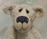 Howard is a charming and very friendly, one of a kind mohair artist bear by Barbara-Ann Bears, he stands 13.5 inches/41cm tall and is 10inches/25cm sitting. Howard is made from a medium length, sparse silvery grey mohair, with grey wool felt paw pads, hand painted glass eyes with hand coloured eyelids and a splendid nose embroidered from charcoal coloured wool