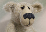 Howard is a charming and very friendly, one of a kind mohair artist bear by Barbara-Ann Bears, he stands 13.5 inches/41cm tall and is 10inches/25cm sitting. Howard is made from a medium length, sparse silvery grey mohair, with grey wool felt paw pads, hand painted glass eyes with hand coloured eyelids and a splendid nose embroidered from charcoal coloured wool