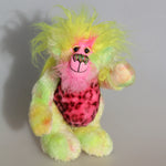 Einstein A Go-Go is a wild and wonderful bear, full of colourful happiness, a one of a kind, mohair artist teddy bear by Barbara-Ann Bears, he stands 9 inches/23 cm tall and is 7 inches/18 cm sitting. He is made from a hand dyed mohair in lime, pink and yellow, his tummy is a very soft 'pink panther' faux fur, his face is a long mohair hand dyed pink, and on top of his head and the backs of his ears is a long plume of luminous yellow faux fur
