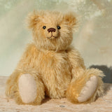 Euan, a mohair collector's teddy bear with a soft texture on a light background