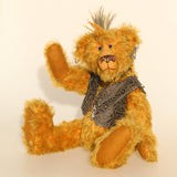 Ezra Plank, a punk Barbara Ann Bear in mustard gold with a mohawk, wearing a faux leather waistcoat