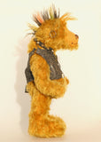 Ezra Plank, a punk Barbara Ann Bear in mustard gold with a mohawk, wearing a faux leather waistcoat