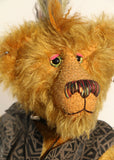 Ezra Plank, close-up of face, a punk Barbara Ann Bear in mustard gold with a mohawk, wearing a faux leather waistcoat
