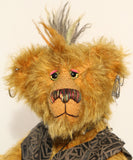 Ezra Plank, close-up of face, a punk Barbara Ann Bear in mustard gold with a mohawk, wearing a faux leather waistcoat