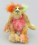 Fiddlesticks teddy bear standing up. He's is a 7 inch kooky, funky and funny one of a kind artist bear in hand-dyed mohair by Barbara Ann Bears with hand painted eyes. He's a little sweetie