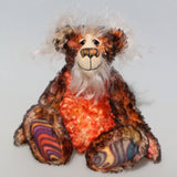 Flambé by Barbara Ann Bears, a handmade, distressed teddy bear with shaggy brown and orange fur, a cream-coloured stitched face, and colourful striped paw pads
