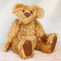 Funky Frankie is a wild and groovy guy, a veteran mohair artist bear from Barbara-Ann Bears, he stands 11 inches (28cm) tall and is 8 inches (20cm) sitting.  Funky Frankie was made in the late 1990s from beautiful English mohair, it's a rich, antique gold, gently distressed mohair and he has brown wool felt paw pads