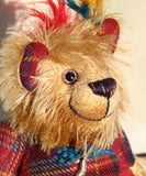 Magnus the Haggis Charmer's beautifully hand painted eyes reflect his colouring as does his carefully embroidered nose. Magnus the Haggis Charmer has two beautiful feathers sew in behind his ear and another attached to the leaf charm he has around his neck