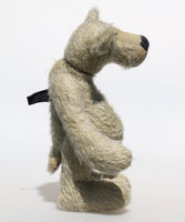 Howard is a charming and very friendly, one of a kind mohair artist bear by Barbara-Ann Bears, he stands 13.5 inches/41cm  tall and is 10inches/25cm sitting.  Howard is made from a medium length, sparse silvery grey mohair, with grey wool felt paw pads, hand painted glass eyes with hand coloured eyelids and a splendid nose embroidered from charcoal coloured wool