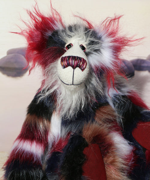 Hudson sitting, close up.
Hudson is a beautifully coloured and dignified one of a kind, artist teddy bear in gorgeous back, burgundy, white and beige faux fur and fluffy white mohair by Barbara-Ann Bears, he stands 15 inches/38 cm tall 