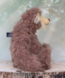 Hullabaloo sitting viewed in profile.
Hullabaloo is a very beary teddy bear a one of a kind, artist bear by Barbara-Ann Bears in wonderful brown faux fur and blonde mohair

Hullabaloo stands 15 inches/38 cm tall 