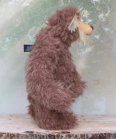 Hullabaloo standing viewed in profile.
Hullabaloo is a very beary teddy bear a one of a kind, artist bear by Barbara-Ann Bears in wonderful brown faux fur and blonde mohair

Hullabaloo stands 15 inches/38 cm tall 