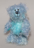 Kieran Cockles is a warm and friendly, one of a kind, artist bear by Barbara-Ann Bears in wonderful fluffy hand-dyed mohair like a blue summer sky, he stands 10 inches/25 cm tall. Kieran Cockles is made from long and fluffy, tousled mohair that Barbara has hand-dyed in a gorgeous sky blue with hand painted glass eyes, a wonderfully embroidered nose and a humongous cheerful smile