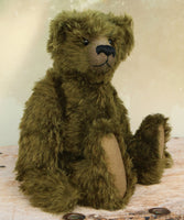 Kingsley Greenacre is a very sweet and cuddly one of a kind traditional artist teddy bear by Barbara Ann Bears in bottle green mohair he is 13 inches/33cm tall.  Kingsley Greenacre is made from a beautiful, distressed bottle green German mohair and he has German wool-felt paw pads that coordinate very well with his mohair. Kingsley has boot buttons for eyes, just like the really old teddy bears. He has a carefully embroidered nose and a sweet smile. 