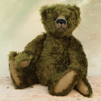 Kingsley Greenacre is a very sweet and cuddly one of a kind traditional artist teddy bear by Barbara Ann Bears in bottle green mohair he is 13 inches/33cm tall.  Kingsley Greenacre is made from a beautiful, distressed bottle green German mohair and he has German wool-felt paw pads that coordinate very well with his mohair. Kingsley has boot buttons for eyes, just like the really old teddy bears. He has a carefully embroidered nose and a sweet smile. 