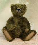 Kingsley Greenacre is a very sweet and cuddly one of a kind traditional artist teddy bear by Barbara Ann Bears in bottle green mohair he is 13 inches/33cm tall.  Kingsley Greenacre is made from a beautiful, distressed bottle green German mohair and he has German wool-felt paw pads that coordinate very well with his mohair. Kingsley has boot buttons for eyes, just like the really old teddy bears. He has a carefully embroidered nose and a sweet smile. 