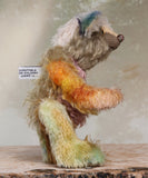 MishMash is a very sweet and friendly, almost traditional one of a kind artist teddy bear by Barbara Ann Bears in a mishmash of traditional and hand dyed mohair, he stands 8 inches/20 cm tall. MishMash has hand painted glass eyes, a nose carefully embroidered in individual threads  and he has the sweetest smile. He is stuffed with polyester stuffing and glass beads, and he has green and cream upholstery fabric paw pads