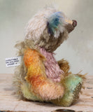 MishMash is a very sweet and friendly, almost traditional one of a kind artist teddy bear by Barbara Ann Bears in a mishmash of traditional and hand dyed mohair, he stands 8 inches/20 cm tall. MishMash has hand painted glass eyes, a nose carefully embroidered in individual threads  and he has the sweetest smile. He is stuffed with polyester stuffing and glass beads, and he has green and cream upholstery fabric paw pads