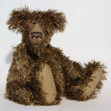 Murdo is a wild and handsome, one of a kind, artist bear by Barbara-Ann Bears in wonderful long and straggly mohair, he stands 18 inches/ 46cm tall.  Murdo is made from a long and wildly tousled, medium brown mohair, with hand painted glass eyes with eyelids, a wonderfully embroidered nose and an engaging smile.