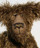 Murdo has beautiful hand painted slightly sparkling glass eyes (they were painted to match his mohair) with eyelids, an impressive and wonderfully embroidered nose, sewn from individual threads to match his mohair and an engaging smile.