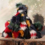 Gillespie is a magnificent, richly colourful one of a kind, artist teddy bear in fabulous faux fur & mohair by Barbara-Ann Bears, he stands 19 inches (48 cm) tall and is 15 inches (38 cm) sitting, Gillespie is made from faux fur in green, deep red, gold, white and black and very long and fluffy white mohair, with hand painted eyes, a beautifully embroidered nose and a sweet smile
