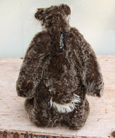 Nicholas Prickleless is a downbeat and curious one of a kind, mohair artist bear by Barbara-Ann Bears, he stands 9 inches/ 23 cm tall Nicholas Prickleless is mostly made from a dense, short dark brown mohair with white tipping, couple with a longer pale cream mohair, cream ultrasuede paws, hand painted eyes and a sweet smile