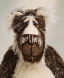 Nicholas Prickleless has beautiful hand painted slightly sparkling glass eyes (they were painted to complement his mohair) with eyelids, a wonderful nose embroidered with individual threads to match his mohair and a broad and cheerful smile