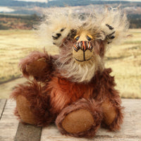 Nimble Nigel sitting and waving. Nimble Nigel is an endearingly sweet and joyful one of a kind artist bear by Barbara-Ann Bears in wonderful brown mohair, he stands just 6.5 inches/17cm 