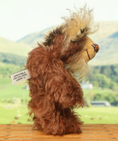 Nimble Nigel standing, side profile. Nimble Nigel is an endearingly sweet and joyful one of a kind artist bear by Barbara-Ann Bears in wonderful brown mohair, he stands just 6.5 inches/17cm 