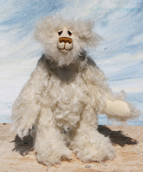 Otis is a sweet and very friendly, one of a kind, artist teddy bear in beautiful long pearl coloured mohair by Barbara-Ann Bears he stands 11 inches/28 cm tall .
Otis is made from a sumptuous, long, very dense, scruffily twirly, nearly white mohair and he has matching pale cream coloured German wool felt paw pads.