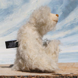Otis is a sweet and very friendly, one of a kind, artist teddy bear in beautiful long pearl coloured mohair by Barbara-Ann Bears he stands 11 inches/28 cm tall .
Otis is made from a sumptuous, long, very dense, scruffily twirly, nearly white mohair and he has matching pale cream coloured German wool felt paw pads.