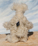 Otis is a sweet and very friendly, one of a kind, artist teddy bear in beautiful long pearl coloured mohair by Barbara-Ann Bears he stands 11 inches/28 cm tall .
Otis is made from a sumptuous, long, very dense, scruffily twirly, nearly white mohair and he has matching pale cream coloured German wool felt paw pads.