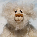 Otis is a sweet and very friendly, one of a kind, artist teddy bear in beautiful long pearl coloured mohair by Barbara-Ann Bears he stands 11 inches/28 cm tall .
Otis is made from a sumptuous, long, very dense, scruffily twirly, nearly white mohair and he has matching pale cream coloured German wool felt paw pads.