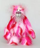 Pamela Pinkerton a colourful teddy bear with pink and white fur and a multicoloured mouth standing on a white background