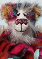 Pepper is a sweet and colourful one of a kind, artist teddy bear in fabulous faux fur and gorgeous mohair by Barbara-Ann Bears and stands 12.5 inches/32 cm tall.   He is made from faux fur in bands of rusty orange, magenta, aqua and a deep mauve, with long, white mohair, turquoise paws, hand painted eyes, a beautifully embroidered nose and a charming smile