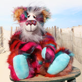 Pepper is a sweet and colourful one of a kind, artist teddy bear in fabulous faux fur and gorgeous mohair by Barbara-Ann Bears and stands 12.5 inches/32 cm tall.   He is made from faux fur in bands of rusty orange, magenta, aqua and a deep mauve, with long, white mohair, turquoise paws, hand painted eyes, a beautifully embroidered nose and a charming smile