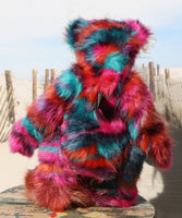 Pepper is a sweet and colourful one of a kind, artist teddy bear in fabulous faux fur and gorgeous mohair by Barbara-Ann Bears and stands 12.5 inches/32 cm tall.   He is made from faux fur in bands of rusty orange, magenta, aqua and a deep mauve, with long, white mohair, turquoise paws, hand painted eyes, a beautifully embroidered nose and a charming smile