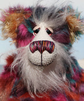 Pepper is a sweet and colourful one of a kind, artist teddy bear in fabulous faux fur and gorgeous mohair by Barbara-Ann Bears and stands 12.5 inches/32 cm tall.   He is made from faux fur in bands of rusty orange, magenta, aqua and a deep mauve, with long, white mohair, turquoise paws, hand painted eyes, a beautifully embroidered nose and a charming smile