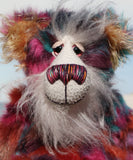 Pepper is a sweet and colourful one of a kind, artist teddy bear in fabulous faux fur and gorgeous mohair by Barbara-Ann Bears and stands 12.5 inches/32 cm tall.   He is made from faux fur in bands of rusty orange, magenta, aqua and a deep mauve, with long, white mohair, turquoise paws, hand painted eyes, a beautifully embroidered nose and a charming smile