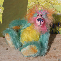 Percival Pringle is a sweet and happy, one of a kind artist bear by Barbara-Ann Bears in tropically colourful hand dyed mohair, he stands 9 inches/23 cm tall. Percival is made from a variety of mohairs, hand dyed in turquoise, pink, orange and yellow. He has hand dyed velvet paws, hand painted eyes, an intricately embroidered nose and a beaming smile. 