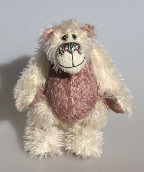 Percy Pufflefluff is a curious and comical one of a kind artist bear by Barbara-Ann Bears in loomstate and heather coloured mohair. Percy Pufflefluff stands 8 inches/ 20 cm. Percy has heather coloured suedette paw pads, beautiful hand painted glass eyes with eyelids, a wonderful nose embroidered and a beaming smile.