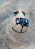 Perry has beautiful hand painted eyes with eyelids, a nose embroidered from individual threads to complement his colouring and he has a huge, friendly smile. Perry is mainly made from a fairly short, sparse hand dyed sky blue, couple with a long fluffy white mohair with blue tipping and hand-dyed velvet paw pads. 