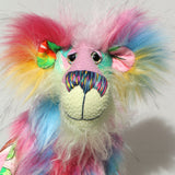 A close up of Plinkety Plonk by Barbara Ann Bears' face, showing his beautiful hand painted eyes, his multi-coloured nose and his beaming smile