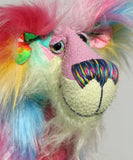 A close up of Plinkety Plonk by Barbara Ann Bears' face, showing his beautiful hand painted eyes, his multi-coloured nose and his beaming smile