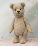 Pooh Who is a sweet and cuddly, traditional artist teddy bear made in splendid German mohair by Barbara Ann Bears, he stands 14 inches/ 36cm tall and is 11 inches/28cm sitting. Pooh Who is made from a silvery grey straight pile German mohair, with beige wool felt paw pads vintage boot buttons for eyes and a sweet smile